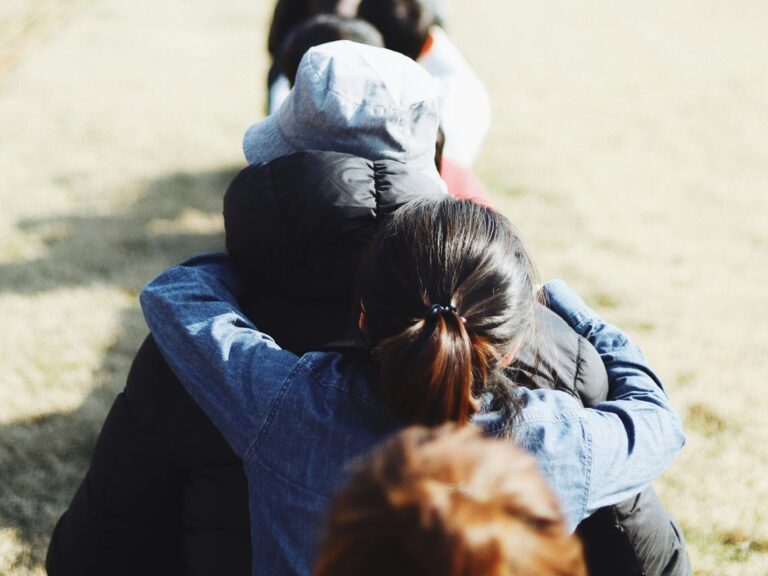 Line of people supporting each other