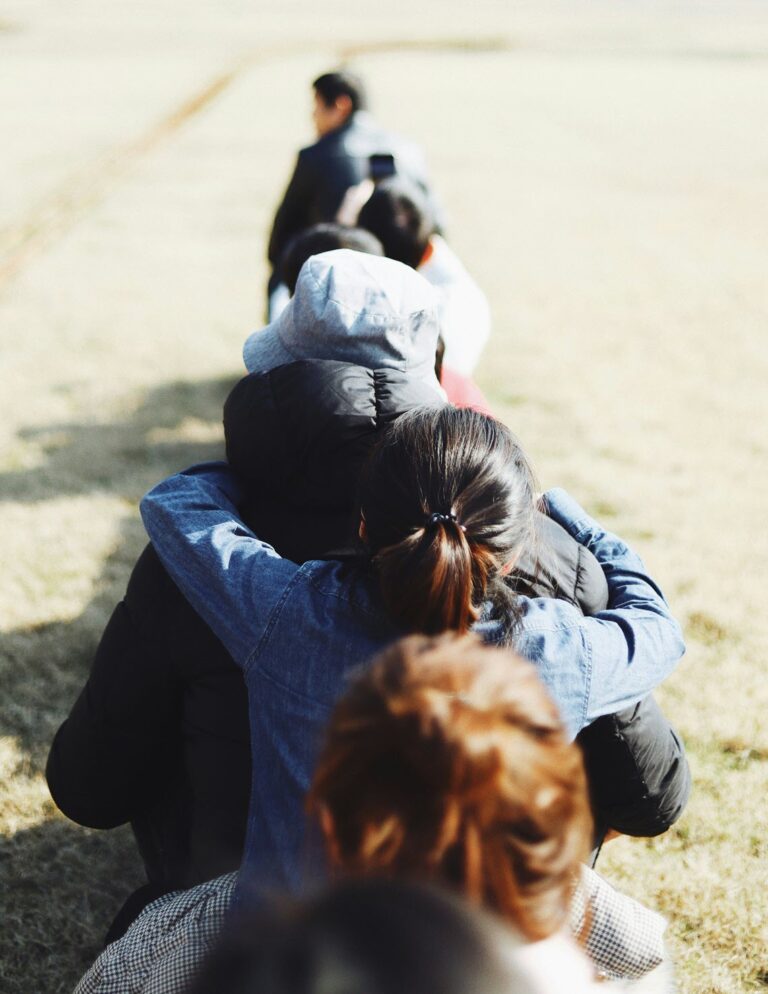 Line of people supporting each other